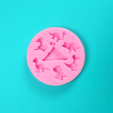 'Dinosaur Icon Silicone Mold for Prehistoric Baking', 'Assorted Dinosaurs and Volcano Baking Mold', 'Durable and Volcano Mold'.