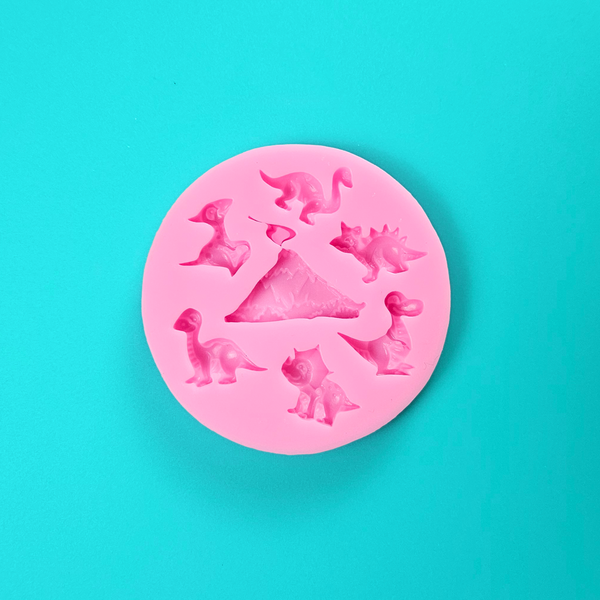 'Dinosaur Icon Silicone Mold for Prehistoric Baking', 'Assorted Dinosaurs and Volcano Baking Mold', 'Durable and Volcano Mold'.