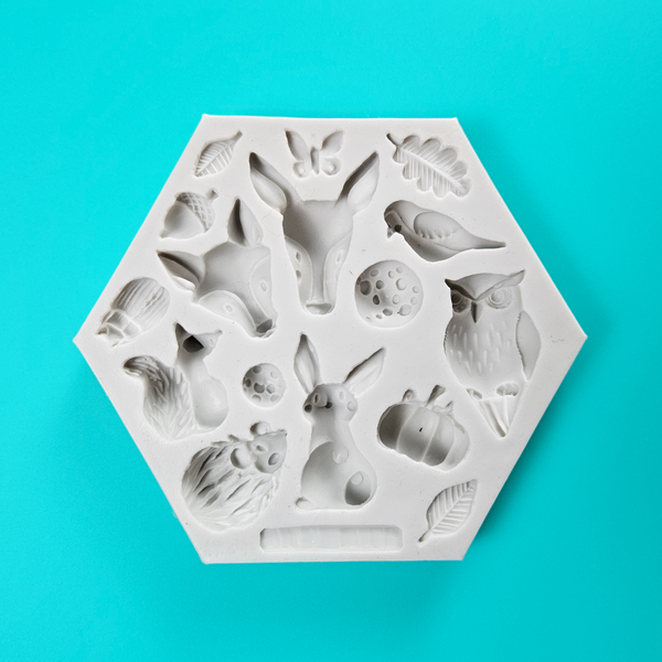  'Woodland Themed Silicone Mold for Enchanting Baking,' 'Assorted Woodland Designs Mold,' 'Durable and Versatile Woodland Mould.'