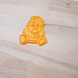 Penguin sitting holding gift - Christmas cookie cutter - just-little-luxuries